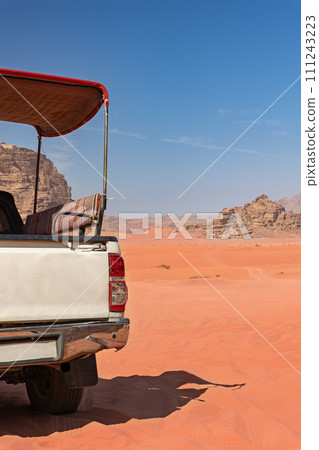 Empty SUV is  standing in Wadi Rum desert. Jordan.  Vertically. 111243223