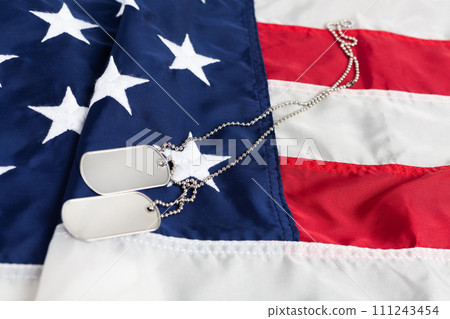 US army dog tags on USA national flag 111243454