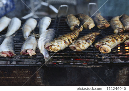 fried herring on the grill fried herring on the grill 111246040