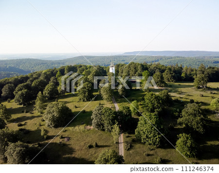 A white tower in a green park with a view of the horizon. Germany countryside 111246374