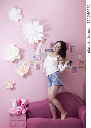 Cute woman having fun in the room 111246682