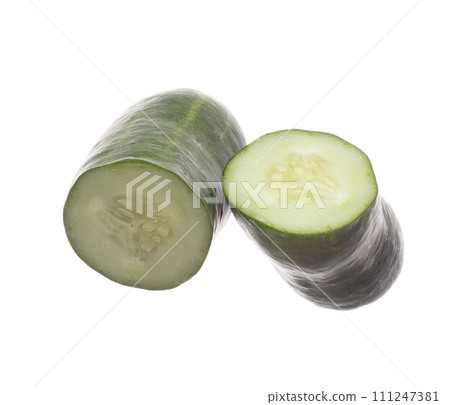 Cucumber fly fall, green fresh vegetable cucumber cut chop slice. Organic fresh vegetable with eaten leaf of long cucumber, close up texture. White background isolated freeze motion high speed shutter 111247381