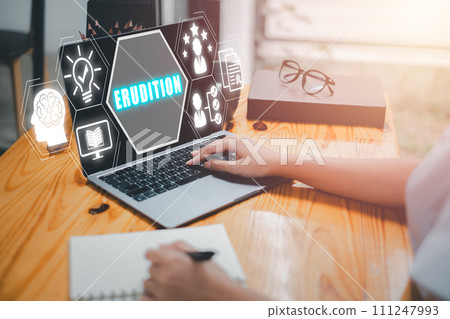 Erudition concept, Business woman using laptop computer on desk with erudition icon on virtual screen. 111247993