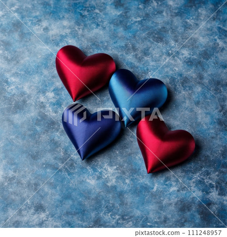Blue and Red silk hearts on a Blue color background 111248957