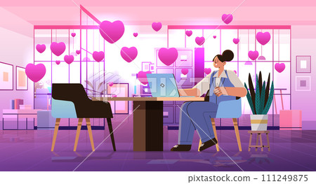 businesswoman in love using laptop social media communication happy valentines day celebration concept office interior with pink hearts 111249875