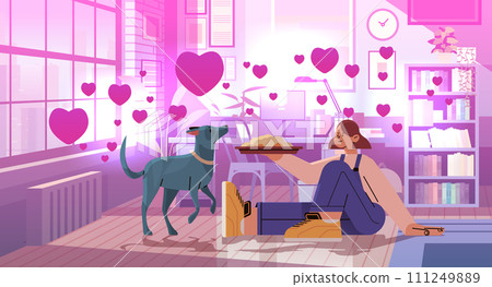 young woman in love spending time with dog female owner and cute domestic animal friendship with pet valentines day celebration young woman in love spending time with dog female owner and cute domestic animal friendship with pet valentines day celebration 111249889