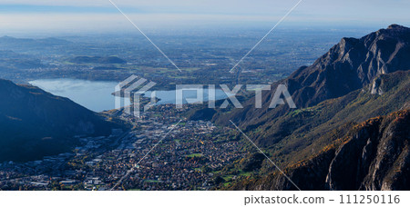 Mountain landscape, picturesque mountain lake in the summer morning, large panorama. Como, Italy Mountain landscape, picturesque mountain lake in the summer morning, large panorama. Como, Italy 111250116