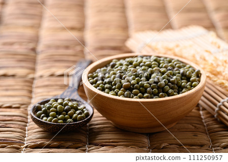Green mung bean in wooden bowl with spoon, Food ingredients Green mung bean in wooden bowl with spoon, Food ingredients 111250957