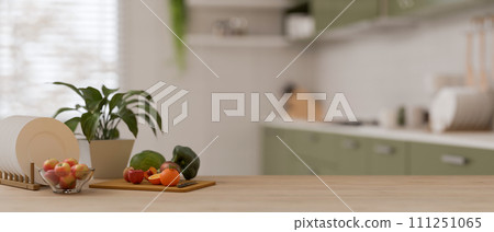 A wooden kitchen countertop with a copy space for display your product against a modern kitchen. 111251065