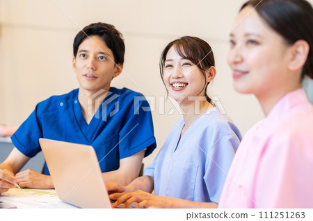 Doctors and nurses having a meeting 111251263