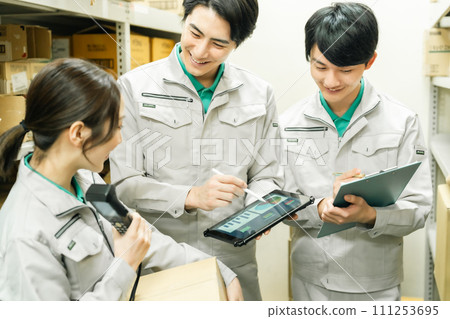 A young man managing inventory in the backyard 111253695