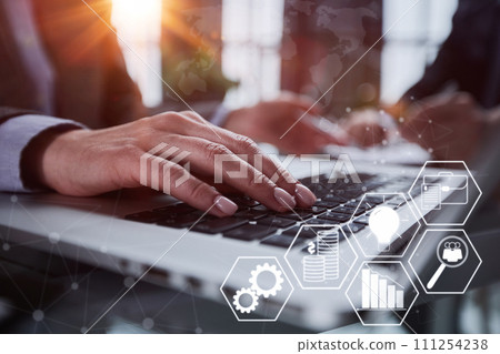 man's hands typing on laptop keyboard in interior man's hands typing on laptop keyboard in interior 111254238