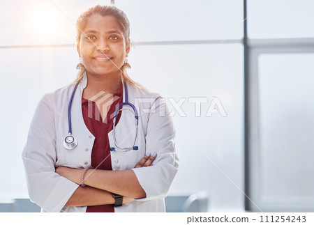 Confident female doctor with his arms crossed 111254243