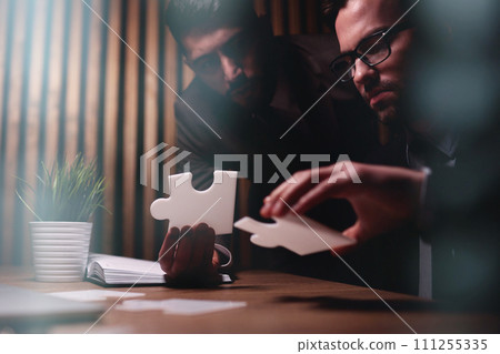 Business teamwork with white puzzle pieces cooperation unity concept Business teamwork with white puzzle pieces cooperation unity concept 111255335