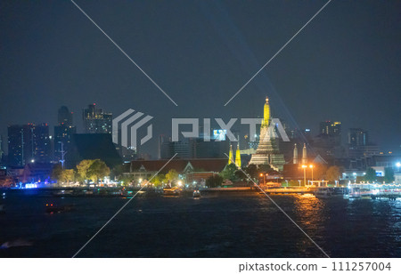 Aerial top view of Temple of Dawn or Wat Arun with urban city town in Rattanakosin Island in architecture, Urban old town city, Bangkok skyline. downtown area, Thailand. 111257004