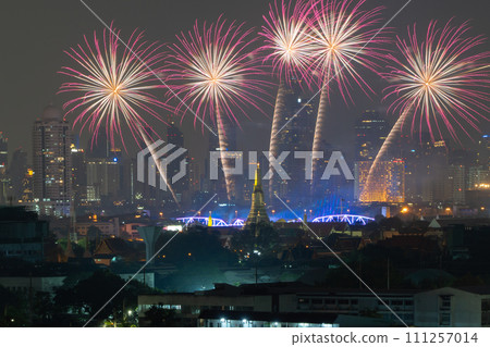 Fireworks of Temple of Dawn or Wat Arun with urban city town in Rattanakosin Island in architecture, Urban old town city, Bangkok skyline. downtown area at night, Thailand. 111257014