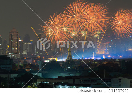 Fireworks of Temple of Dawn or Wat Arun with urban city town in Rattanakosin Island in architecture, Urban old town city, Bangkok skyline. downtown area at night, Thailand. 111257023