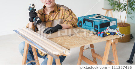 Middle-aged man doing DIY Middle-aged man doing DIY 111257456