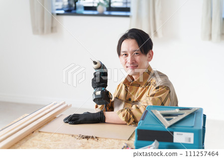Middle-aged man doing DIY 111257464