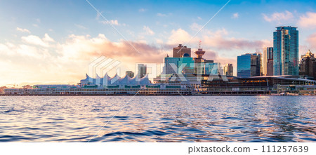 Canada Place and city building skyline at cloudy sunrise. Downtown Vancouver Canada Place and city building skyline at cloudy sunrise. Downtown Vancouver 111257639