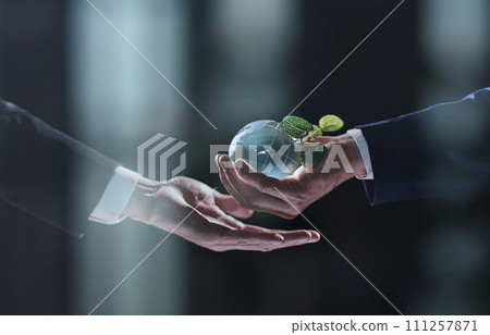 Plabt Growing inside a Sphere - Hand Holding - Eco Concept 111257871