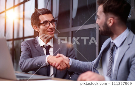 managers discussing plans in a modern office 111257969