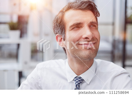 Confident young businessman posing in the office 111258694