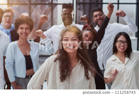 Multiethnic young business people working together in the office Multiethnic young business people working together in the office 111258743