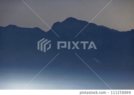 Night view of Mt. Kaikomagatake seen from Yatsugatake mountain range and Mt. Tennyo Night view of Mt. Kaikomagatake seen from Yatsugatake mountain range and Mt. Tennyo 111258869