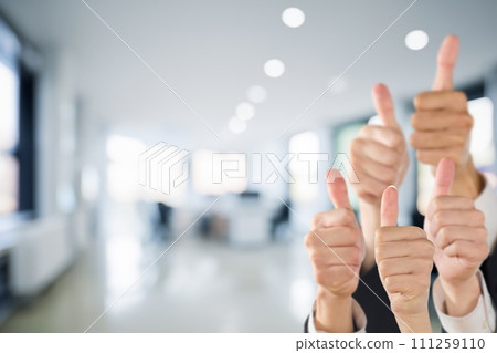 Business person giving good sign in office background 111259110