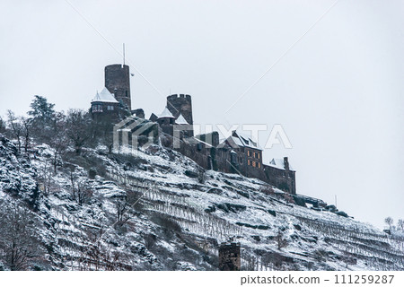 Winter at Burg Thurant Castle at the Mosel vineyards nestled in the hills above the Moselle River Germany Town Alken Winter at Burg Thurant Castle at the Mosel vineyards nestled in the hills above the Moselle River Germany Town Alken 111259287
