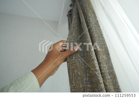 close up of holding a clean fabric curtain. 111259553