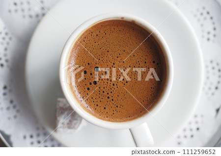 a cup of turkish coffee on table  111259652