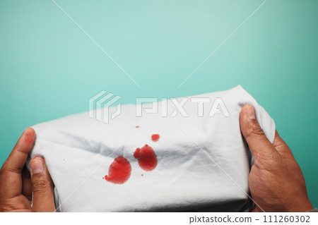 blood stains on a white shirt. blood stains on a white shirt. 111260302