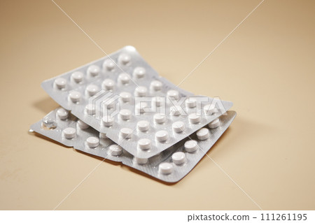 Close up of pills of blister pack on table Close up of pills of blister pack on table 111261195