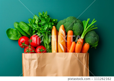 Craft brown shopping paper bag and grocery on blue background. Delivery concept Craft brown shopping paper bag and grocery on blue background. Delivery concept 111262162