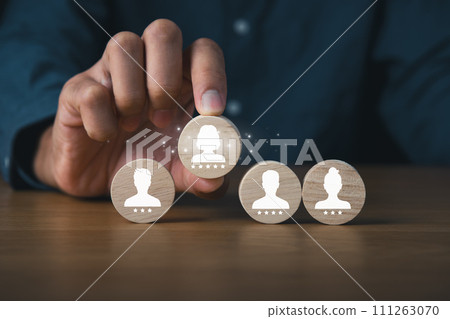 HR Human Resource searching new employee,Business and HR recruit concept.Business man holding wooden of  candidate. 111263070