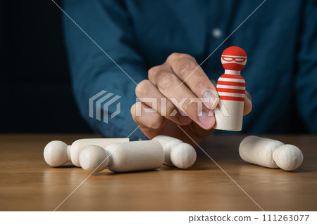 businessman holding wooden of thief hacker in business team for Cybersecurity and hacker concept 111263077