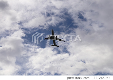 Airplane flying in the clouds 111263962