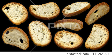 Bruschetta crackers, round bread croutons isolated on black background, full depth of field Bruschetta crackers, round bread croutons isolated on black background, full depth of field 111264025