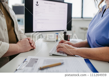 Doctor consulting with overweight patient, discussing test result in doctor office. Concept of health risks of overwight and obesity. 111264939