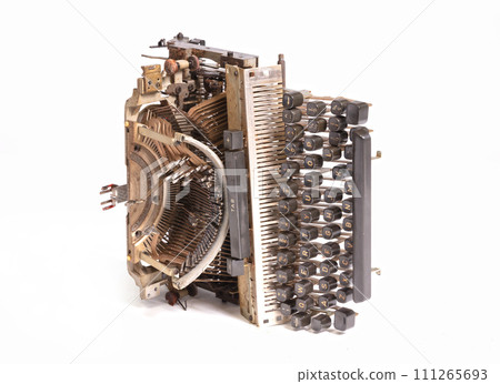 Broken metal typewriter, vintage object 111265693