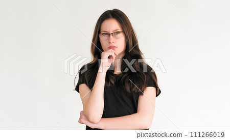 Confused thinking. Problem solution. Pensive skeptic smart woman in glasses considering idea making decision plan isolated on white empty space background. 111266019