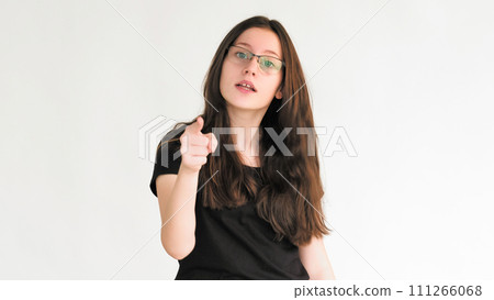 Conflict argument. Quarrel disagreement. Annoyed angry dissatisfied strict woman warning pointing finger isolated on white empty space background. 111266068