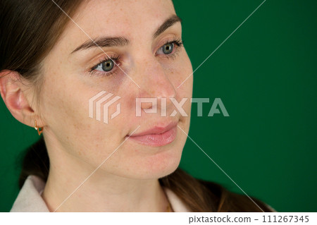 Close-up portrait of yong woman casual portrait in positive view, big smile, beautiful model posing in studio  111267345
