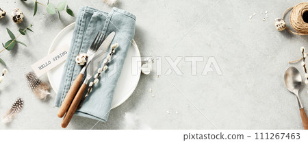 Easter table setting with spring flowers and cutlery. Holidays background 111267463