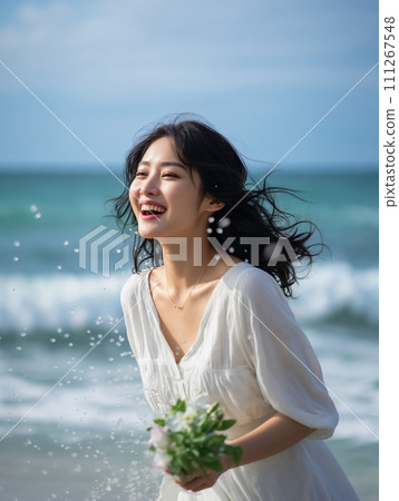 A woman in a white dress smiling while holding a bouquet of flowers at the sea A woman in a white dress smiling while holding a bouquet of flowers at the sea 111267548