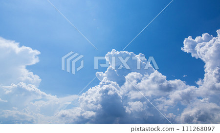 Cumulonimbus clouds appearing in the blue sky 111268097