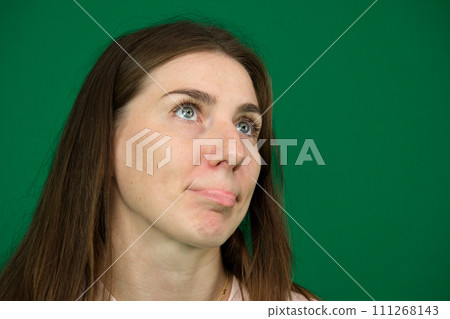 carve out lower lip woman on green background chroma key dissatisfied reaction roll eyes assume 111268143