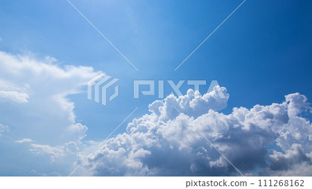 Cumulonimbus clouds appearing in the blue sky 111268162